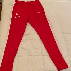 Nike men’s track pants with double swoosh on front with mcmlxxii on back